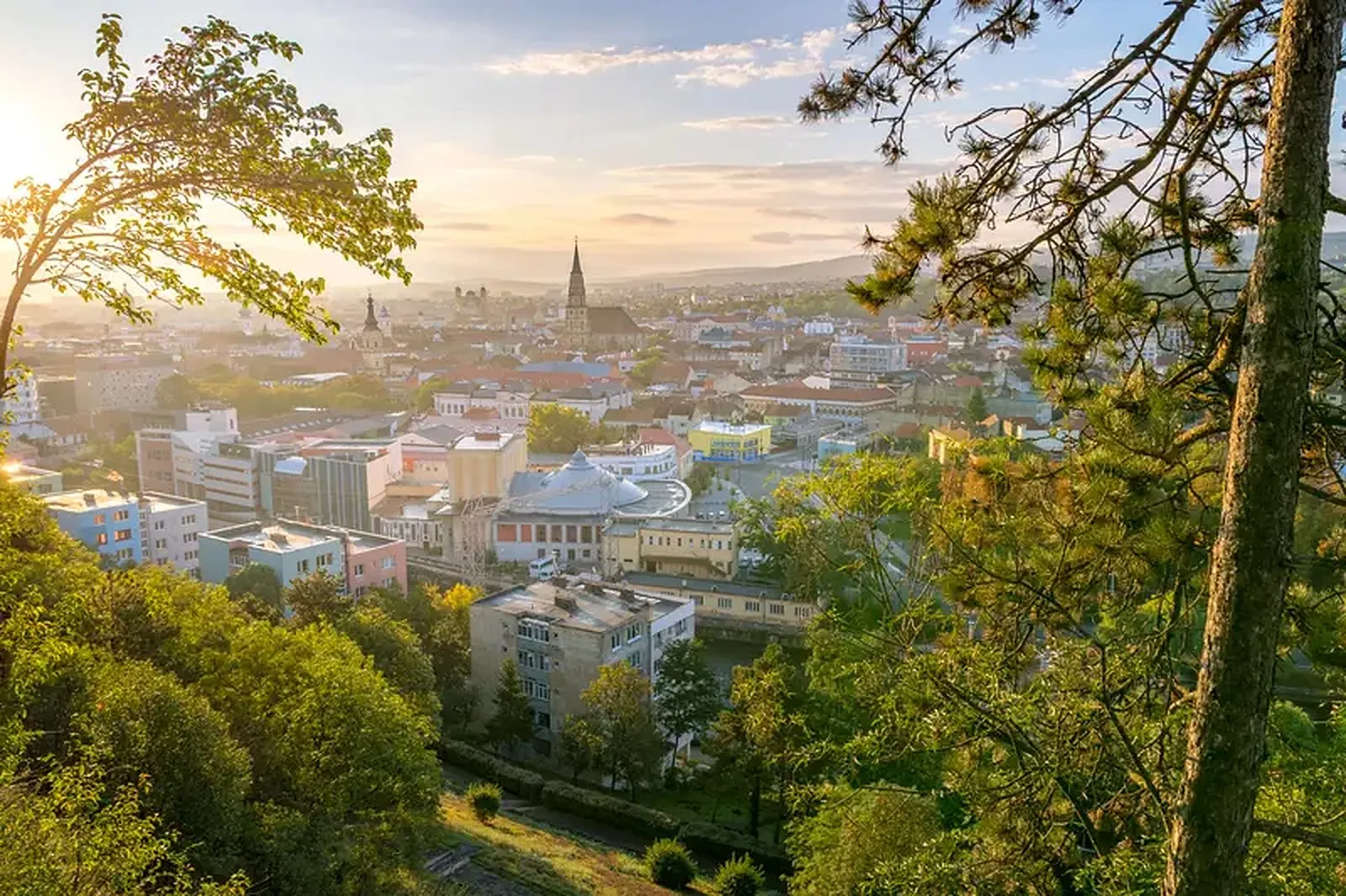 Cluj-Napoca at sunset, seen from Cetățuia Hill, with St. Michael’s Church on the skyline